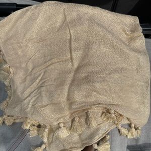 This is a gold shawl.  This is used and in good condition.